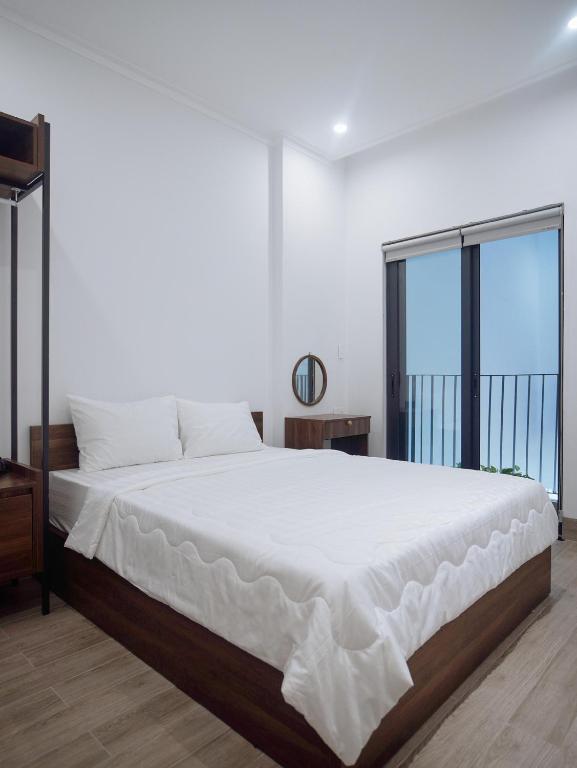 Giường trong phòng chung tại Amber Hotel