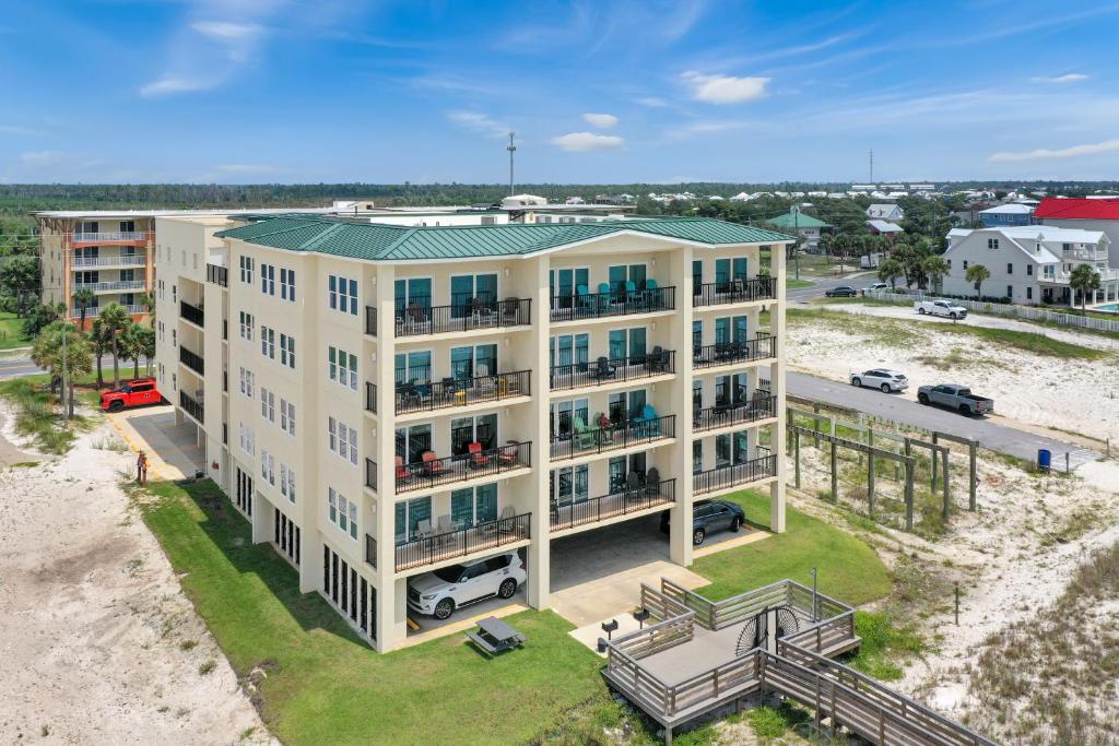 an aerial view of a building on the beach at One More Time Again by Pristine Properties Vacation Rentals in Mexico Beach