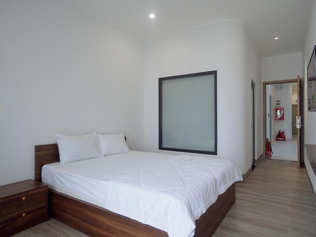 Giường trong phòng chung tại Amber Hotel