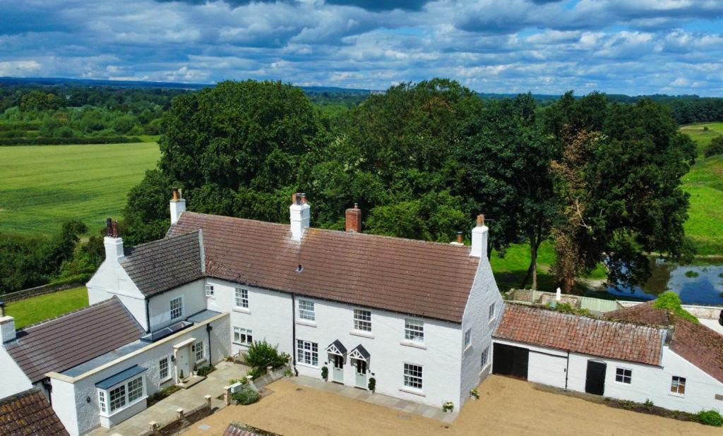 an aerial view of a large white house at Givendale Cottages, Newby Hall, Ripon, North Yorkshire in Ripon
