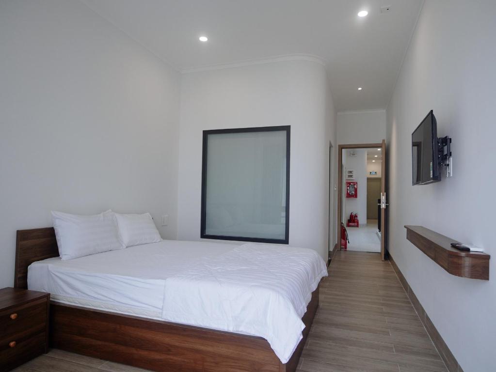Giường trong phòng chung tại Amber Hotel