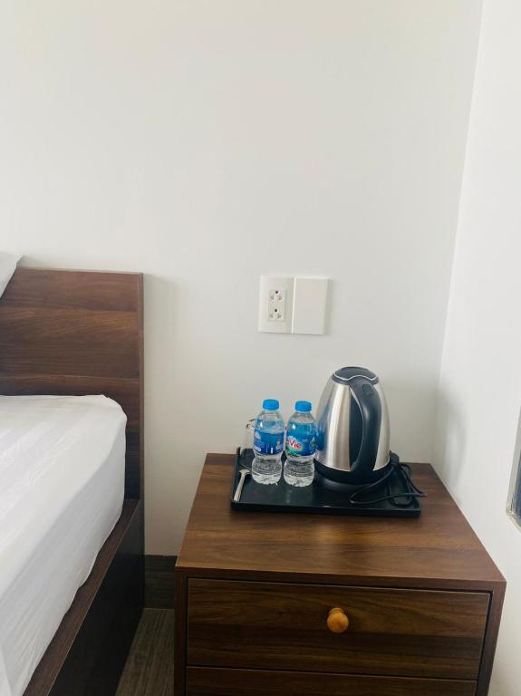 Giường trong phòng chung tại Amber Hotel