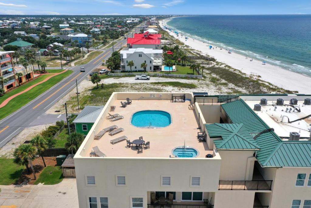 an aerial view of a resort with a pool and the beach at One More Time Again by Pristine Properties Vacation Rentals in Mexico Beach