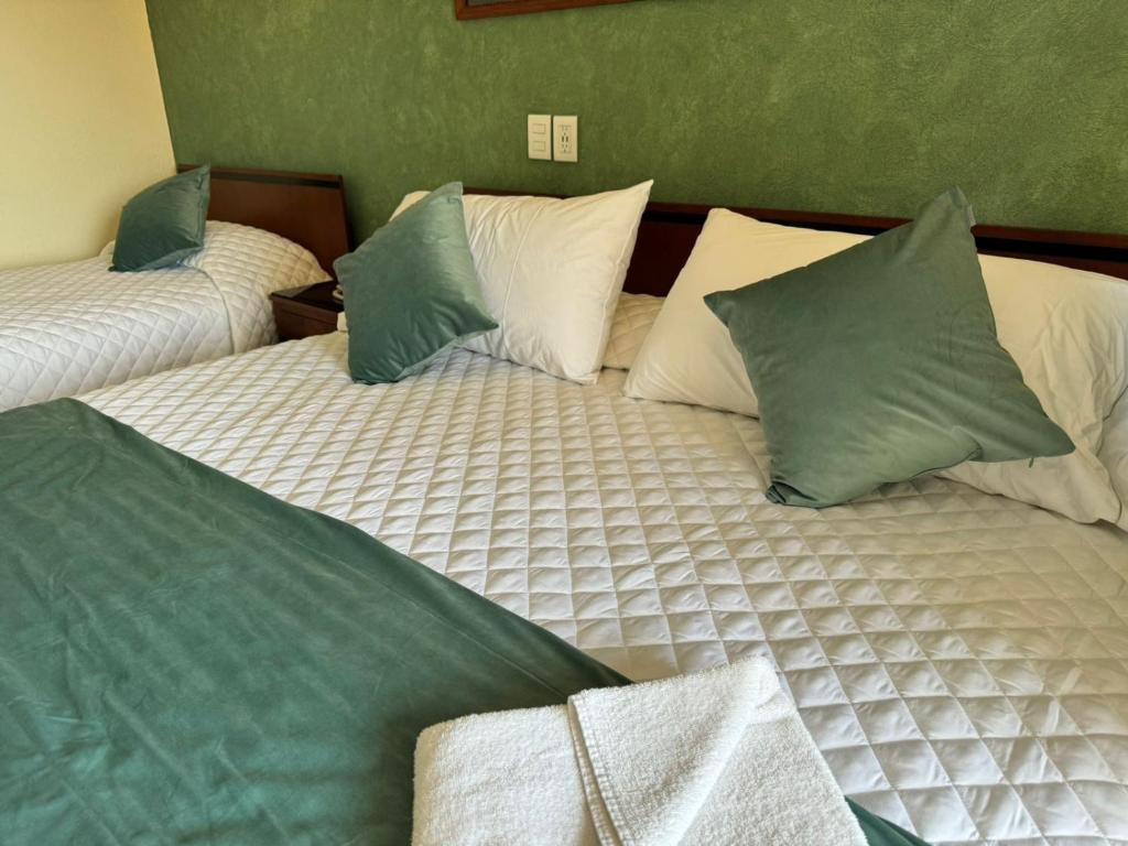 Postel nebo postele na pokoji v ubytování Hotel Bello Cordoba
