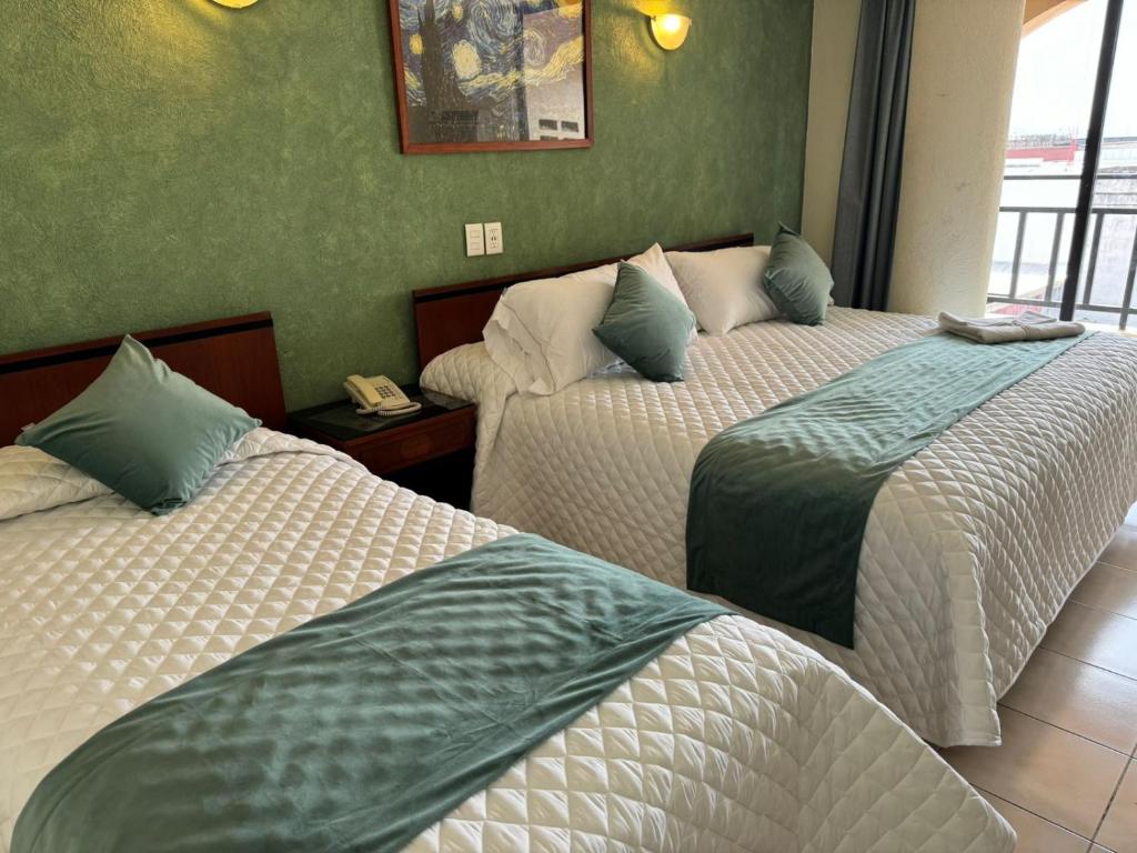 Postel nebo postele na pokoji v ubytování Hotel Bello Cordoba