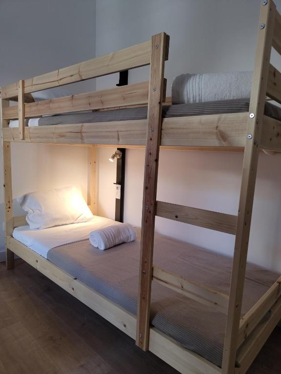 Postel nebo postele na pokoji v ubytování Urbe Sanchina - Hostel & Suites