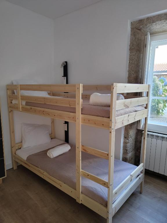 Postel nebo postele na pokoji v ubytování Urbe Sanchina - Hostel & Suites