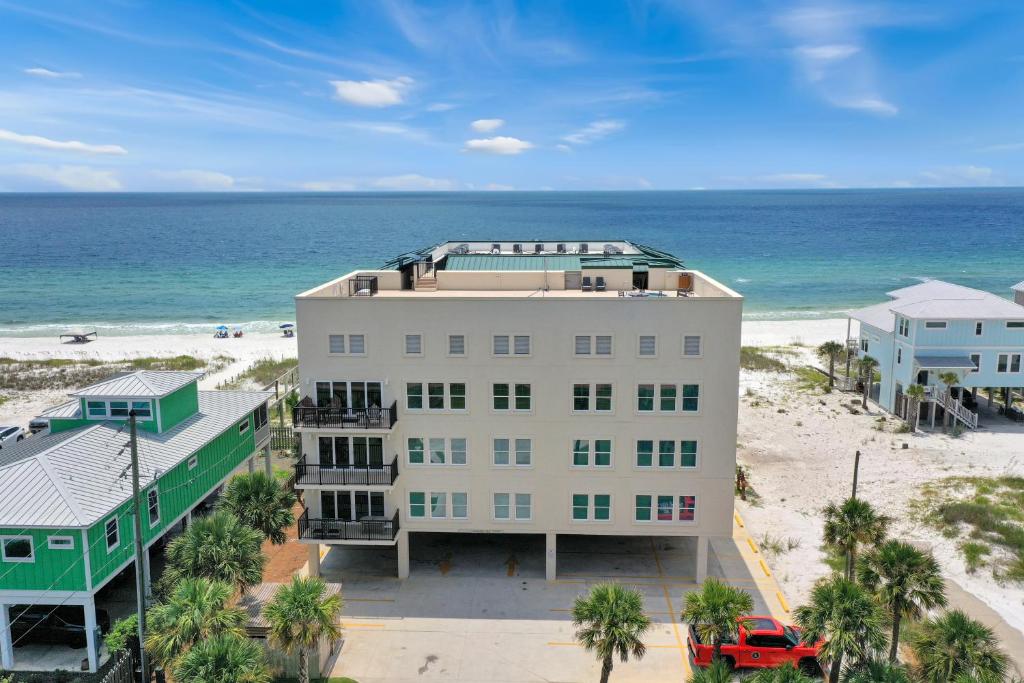 an aerial view of a building on the beach at One More Time Again by Pristine Properties Vacation Rentals in Mexico Beach