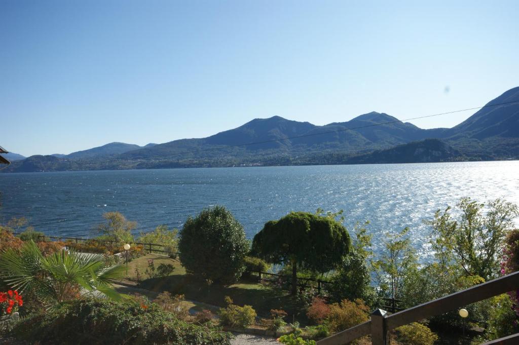 a view of a lake with mountains in the background at Miralba in Ghiffa