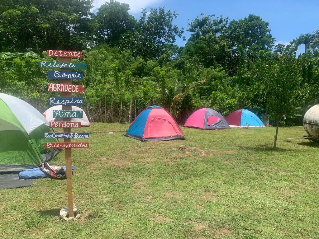 a sign in front of a group of tents at Camping La Bucara in Cabeza de Vaca
