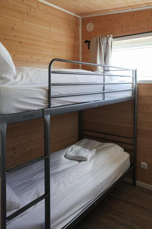 Postel nebo postele na pokoji v ubytování Hestheimar
