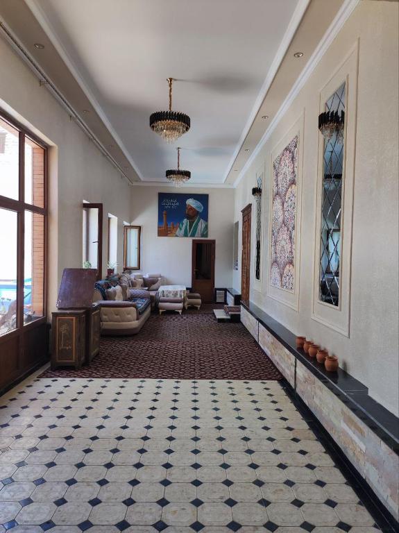 a living room with a couch and a table at Saidjanov Hostel in Bukhara