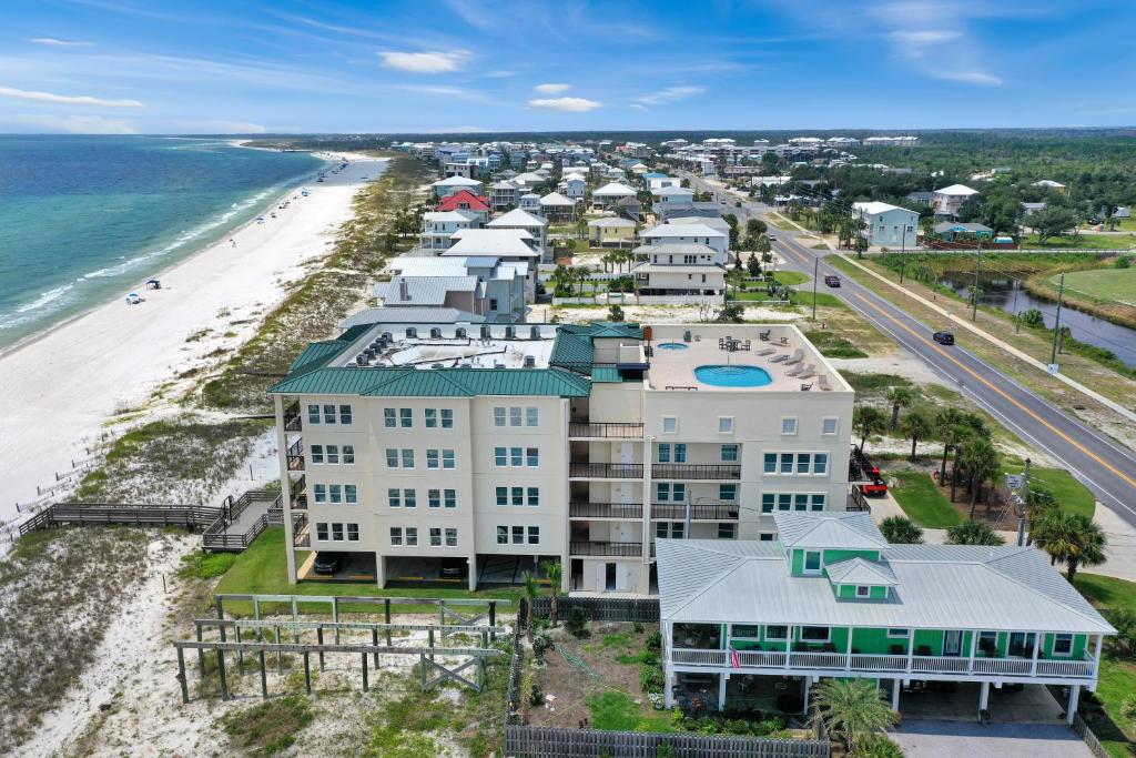 an aerial view of the beach and buildings at One More Time Again by Pristine Properties Vacation Rentals in Mexico Beach