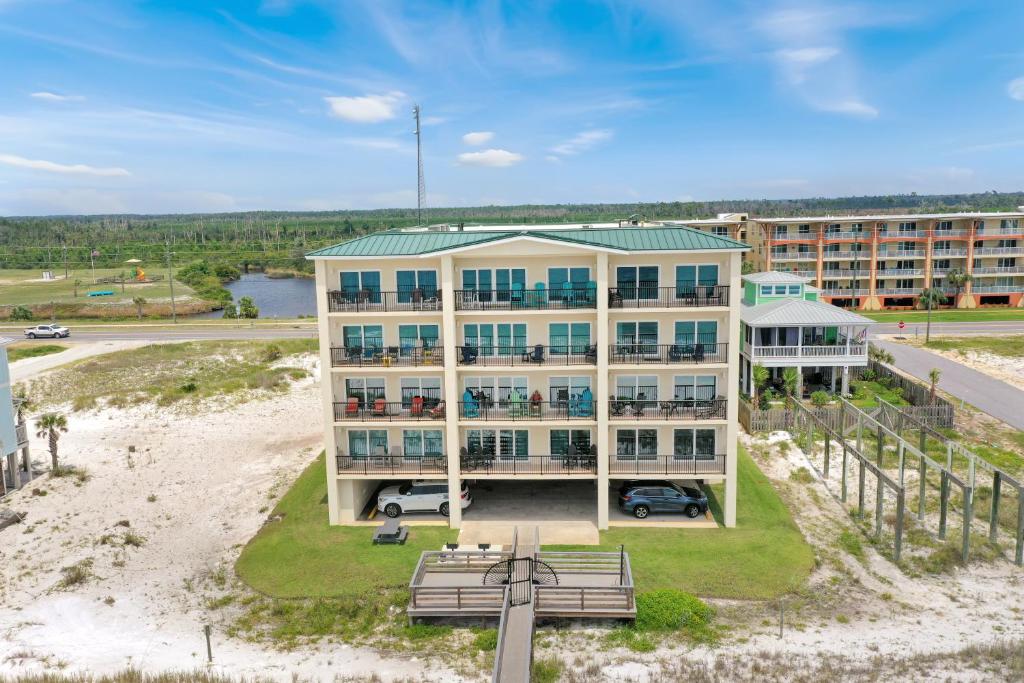 an aerial view of a building with a beach at One More Time Again by Pristine Properties Vacation Rentals in Mexico Beach
