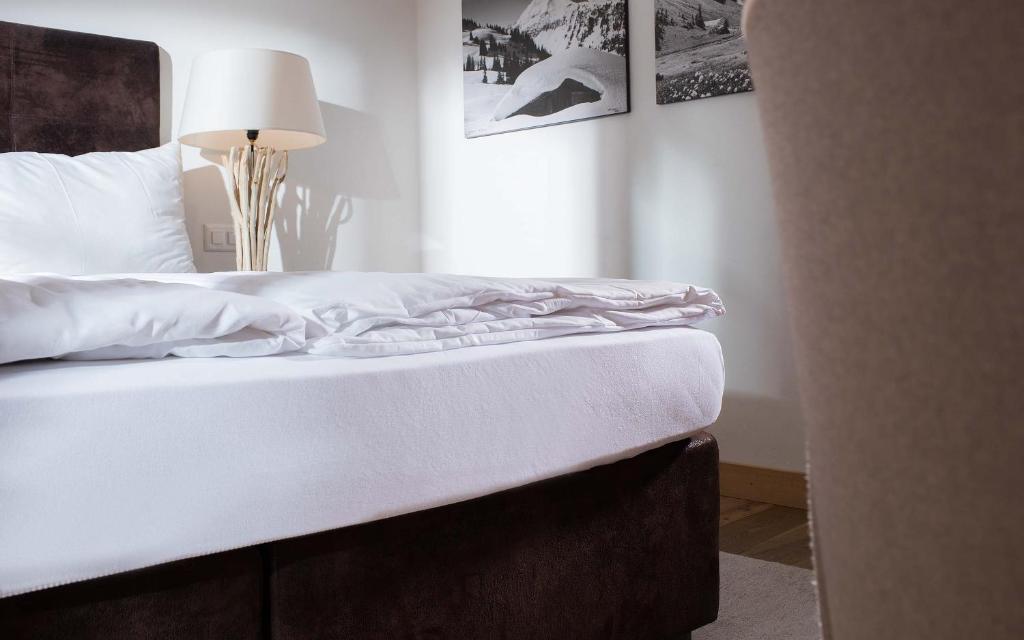 Postel nebo postele na pokoji v ubytování Hotel des Alpes Superieur