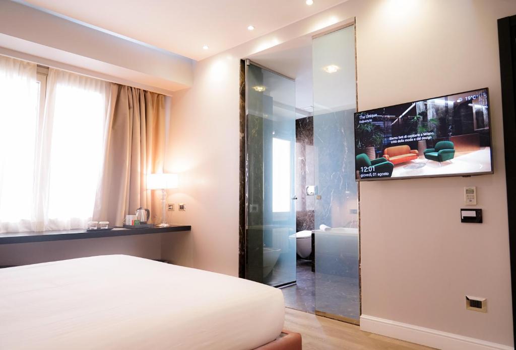 TV a/nebo společenská místnost v ubytování The Unique Hotel