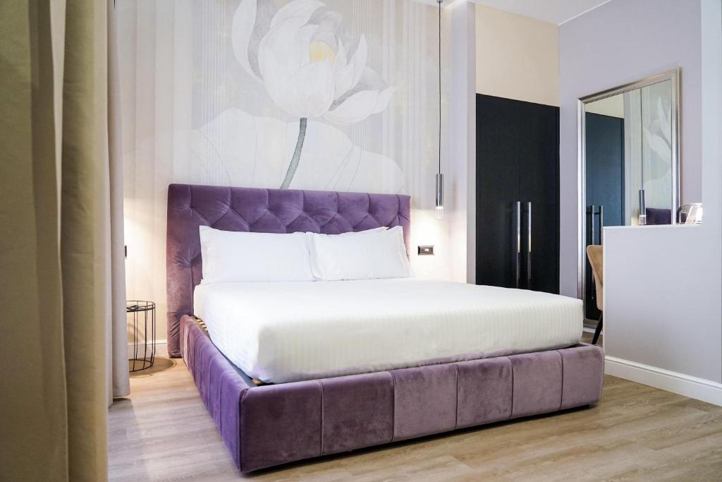 Postel nebo postele na pokoji v ubytování The Unique Hotel