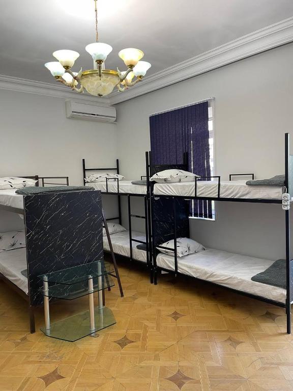 Postel nebo postele na pokoji v ubytování Olympic Hostel