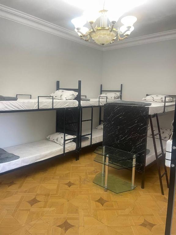 Postel nebo postele na pokoji v ubytování Olympic Hostel