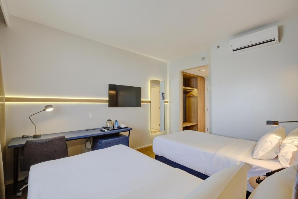 Cama o camas de una habitación en Hampton by Hilton Guarulhos Airport