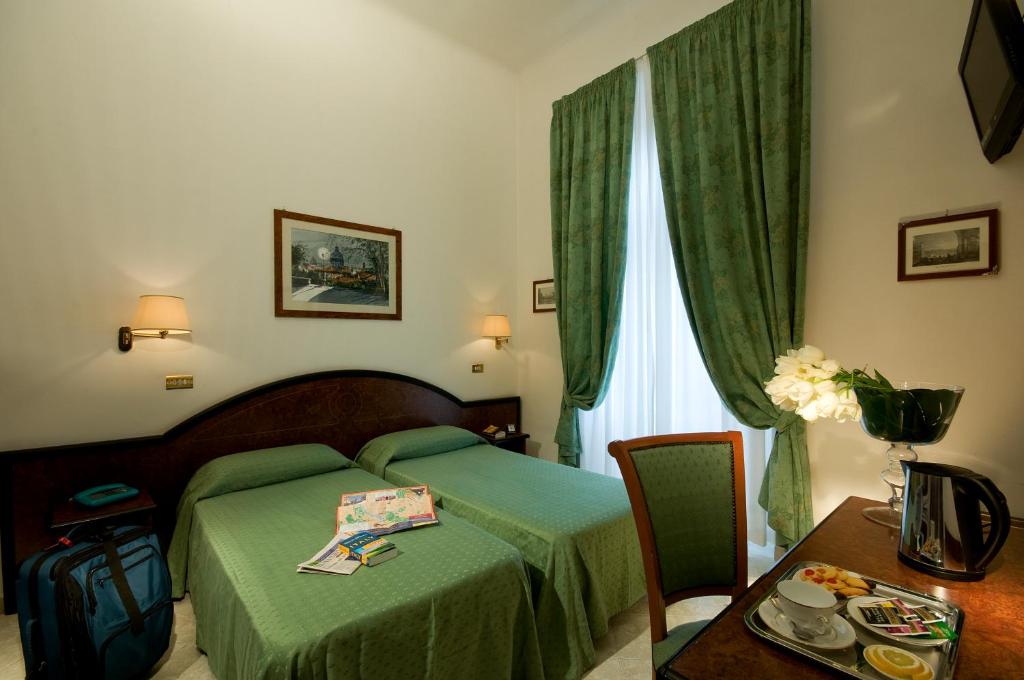 Postel nebo postele na pokoji v ubytování Hotel Sonya