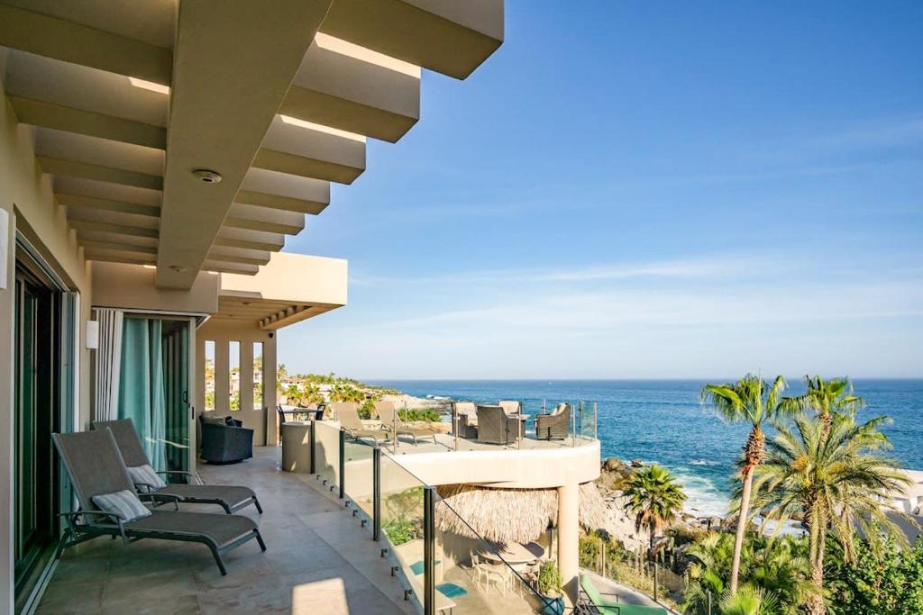 a view of the ocean from the balcony of a house at Villa Alegria in El Pueblito