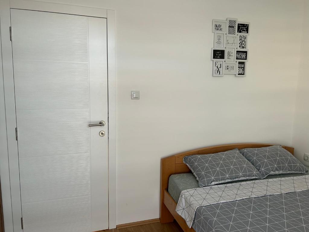 Postel nebo postele na pokoji v ubytování Apartman Dunja
