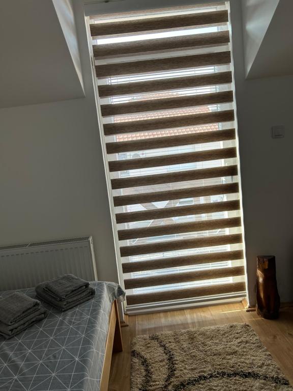 Postel nebo postele na pokoji v ubytování Apartman Dunja