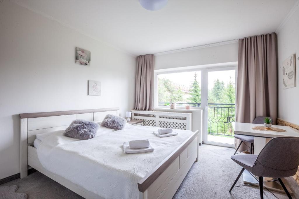 Postel nebo postele na pokoji v ubytování Apartmány Nezábudka, Tatranská Štrba - 5 minút od zubačky