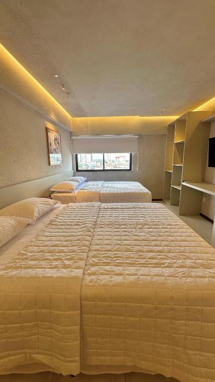 Postel nebo postele na pokoji v ubytování Loft 1 Edf celita Franca Business hotel