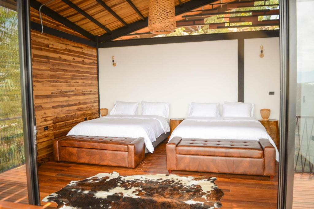 Katil atau katil-katil dalam bilik di Hotel Aborígenes