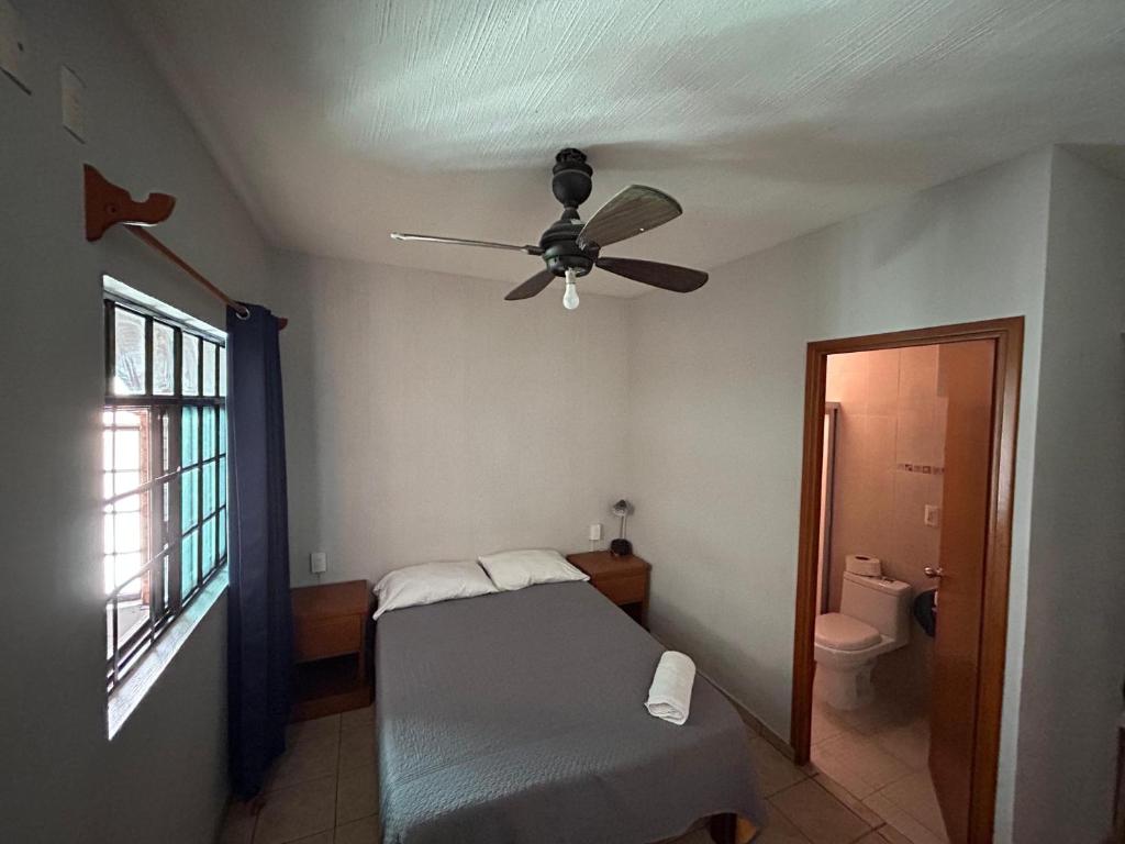 Postel nebo postele na pokoji v ubytování Suites Chingón