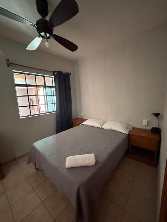 Postel nebo postele na pokoji v ubytování Suites Chingón
