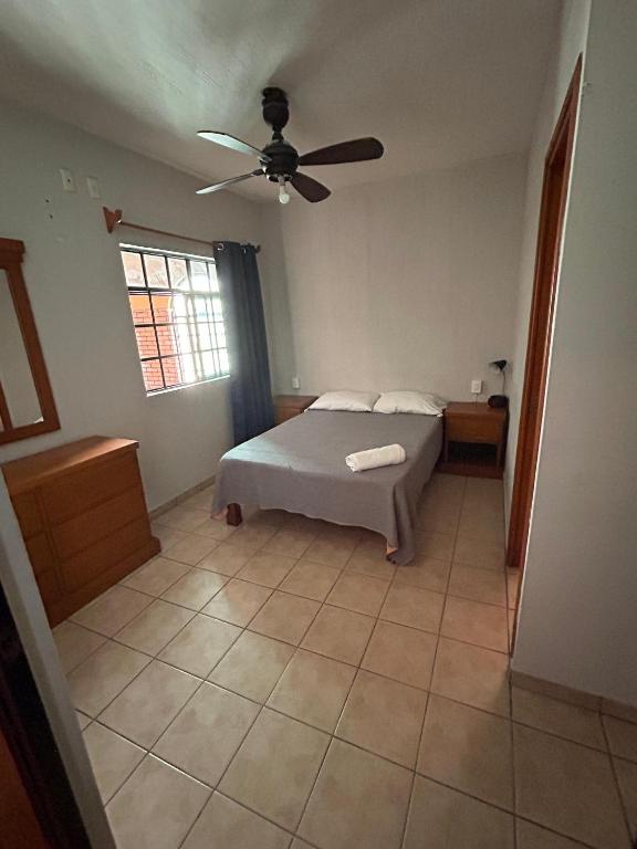 Postel nebo postele na pokoji v ubytování Suites Chingón