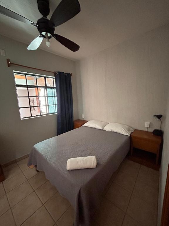 Postel nebo postele na pokoji v ubytování Suites Chingón