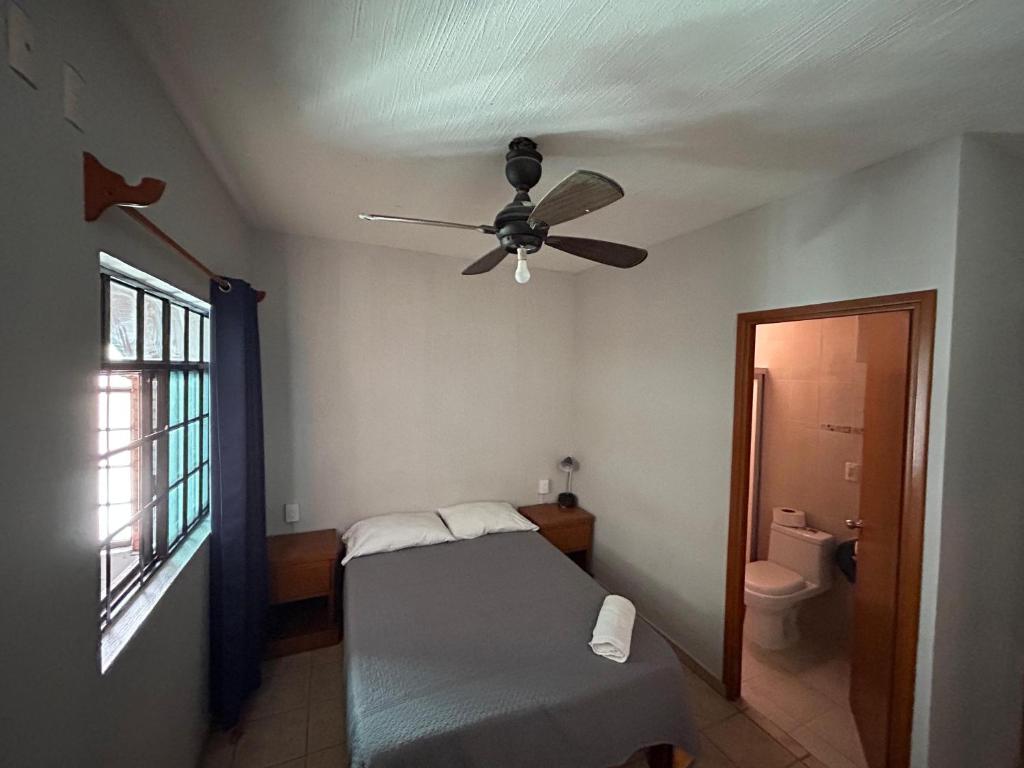 Postel nebo postele na pokoji v ubytování Suites Chingón