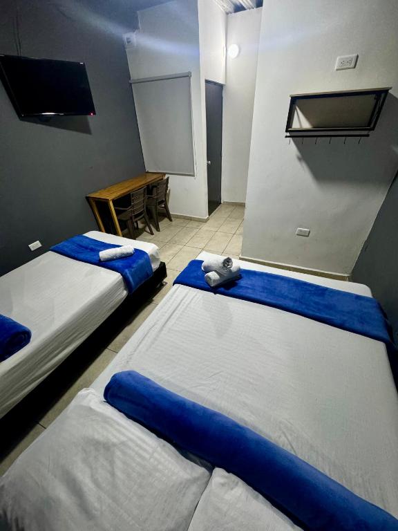 Postel nebo postele na pokoji v ubytování Hotel Select Medellin