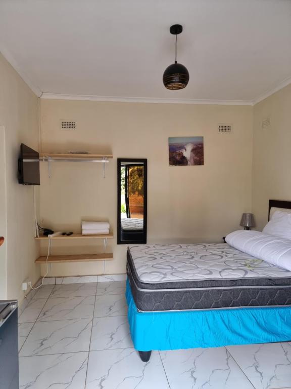 Postel nebo postele na pokoji v ubytování Gono Compound