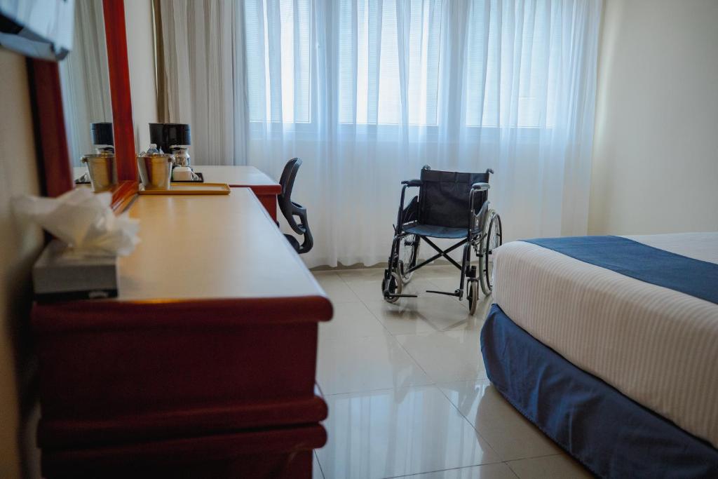 Postel nebo postele na pokoji v ubytování Hotel Hostal de Cortés