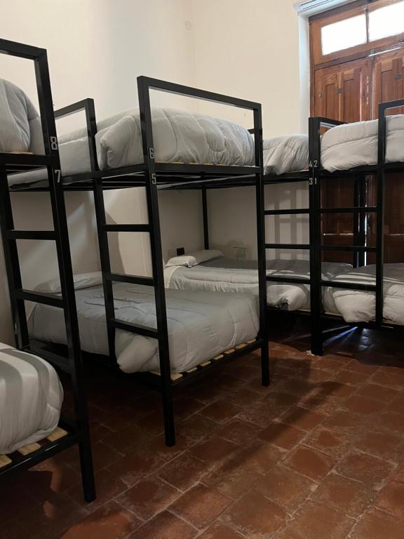 Postel nebo postele na pokoji v ubytování La Félicité Hostel