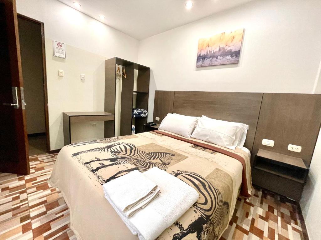 Postel nebo postele na pokoji v ubytování Hotel Coronado