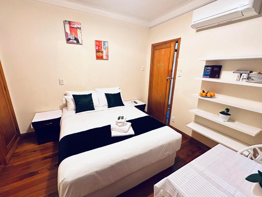 Postel nebo postele na pokoji v ubytování Harrison Motel Papatoetoe
