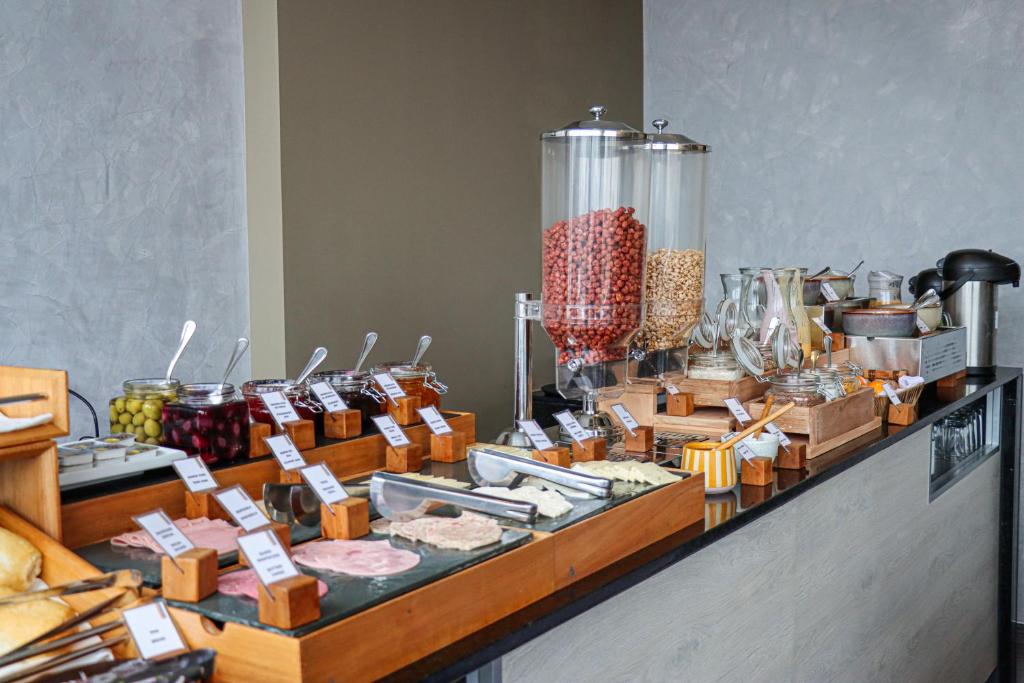 a buffet with many different types of food on display at Rado Hotel - Santa María in Trujillo