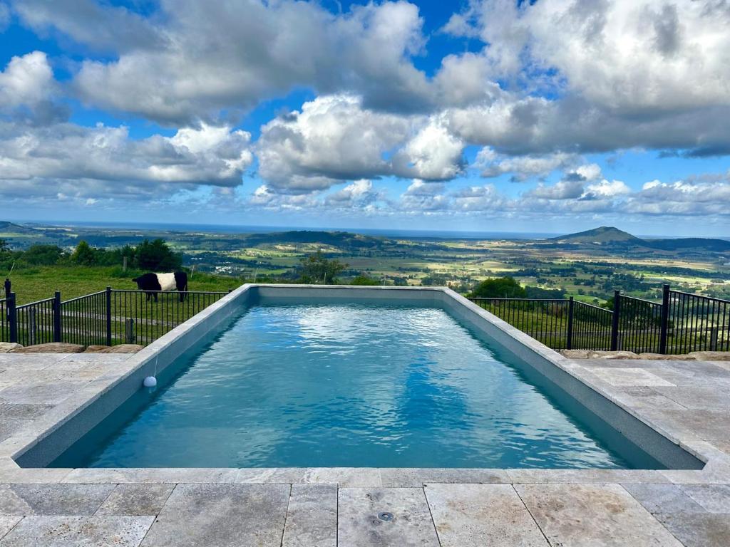 a swimming pool with a view of the mountains at Allure - By Berry Getaways in Berry