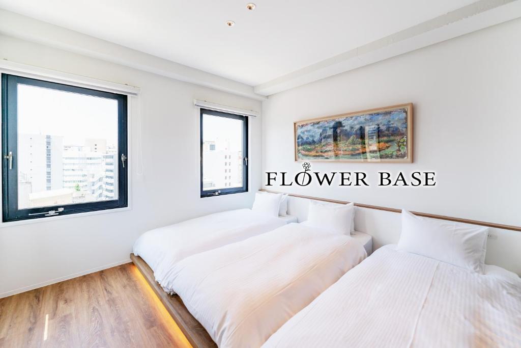Ένα ή περισσότερα κρεβάτια σε δωμάτιο στο Flower Base HIMAWARI