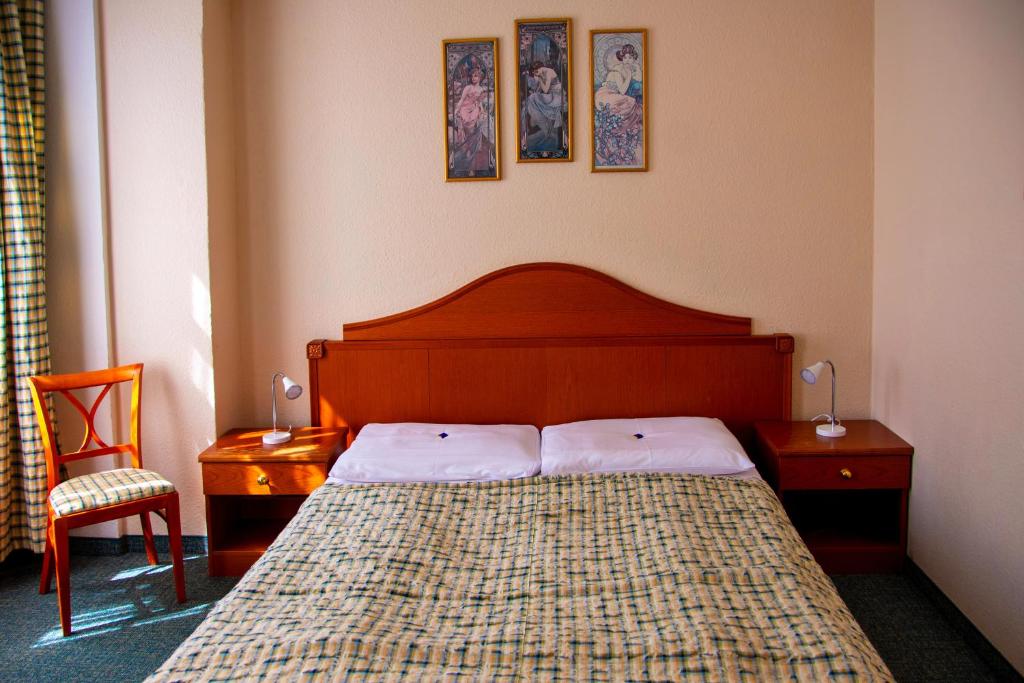 Postel nebo postele na pokoji v ubytování EA Hotel Mozart