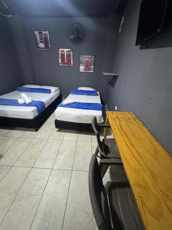 Postel nebo postele na pokoji v ubytování Hotel Select Medellin
