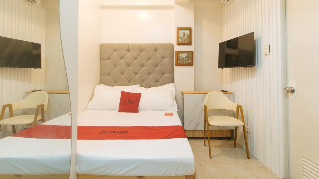 TV a/nebo společenská místnost v ubytování RedDoorz at Delorian Residences