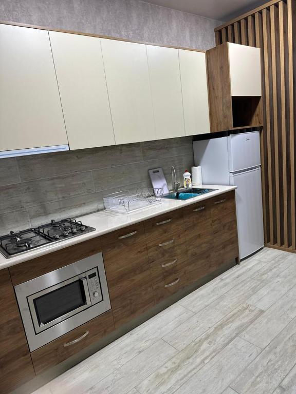 Kuchyň nebo kuchyňský kout v ubytování Cottage V1