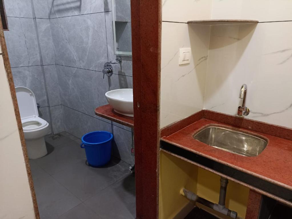 Koupelna v ubytování Om Ganesh Naik Guest House